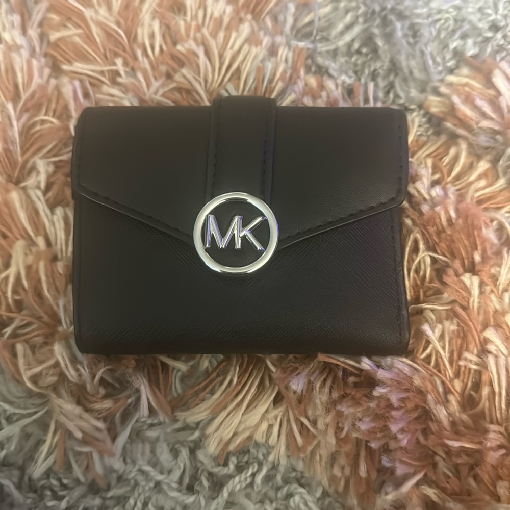 Black woman’s Michael Kors wallet. Brand new. It was never used. It was a gift